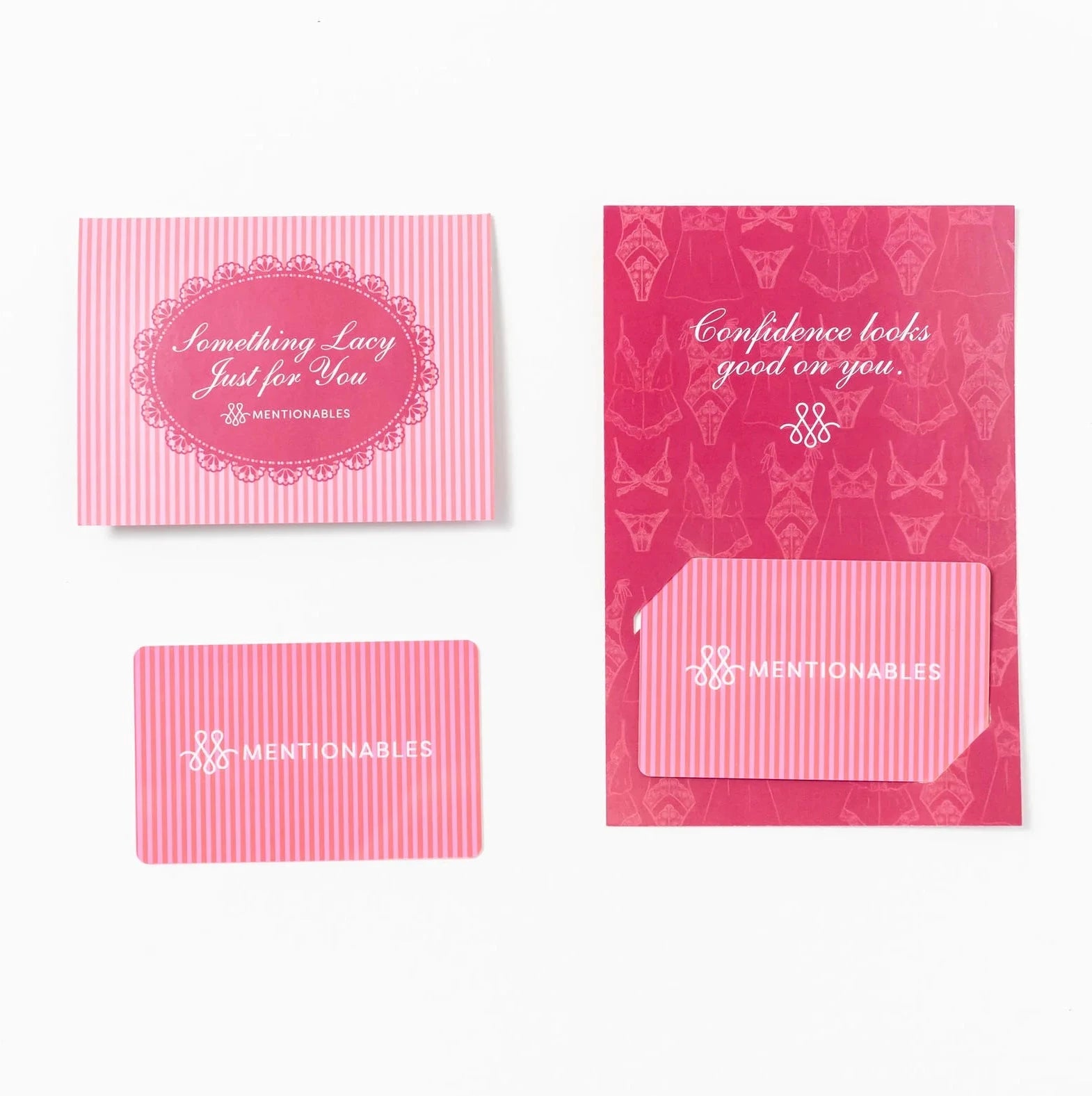 Pink striped and patterned gift cards and a matching envelope on a plain white background.