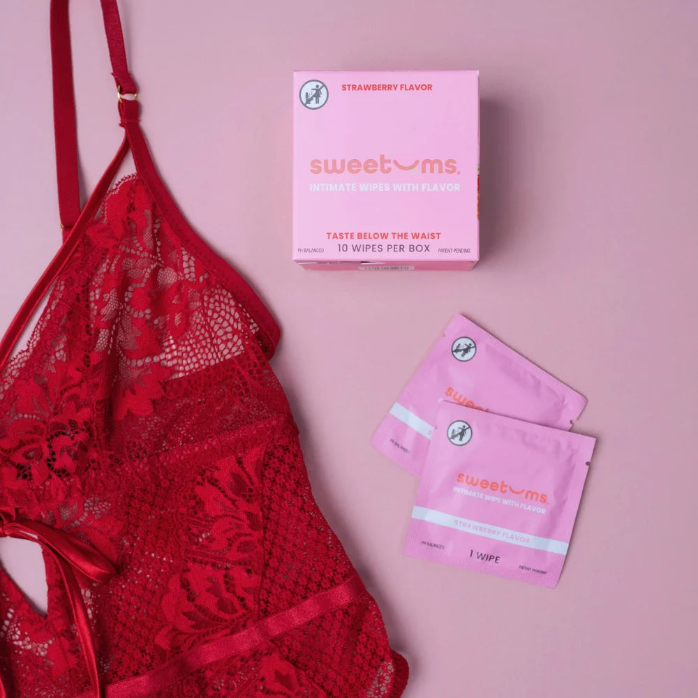 Sweetums Intimate Wipes with flavor, Strawberry single package wipes with 10 per box pictured with a red teddy.